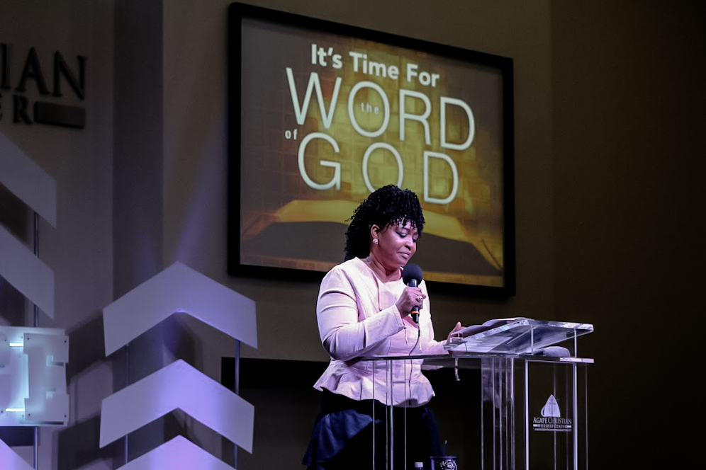 Prophet Isha Odom speaking at the podium Agape Christian Worship Center, Albany, GA
